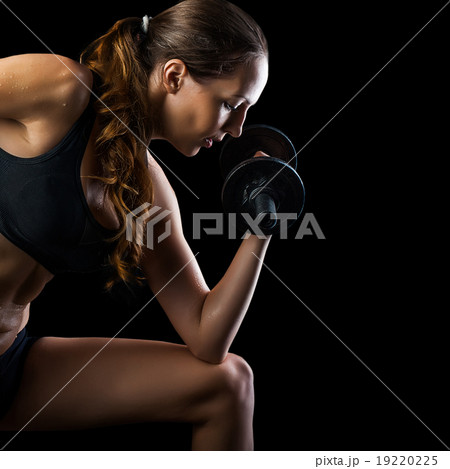 Workout with personal trainer. Instructor helping girl in gym