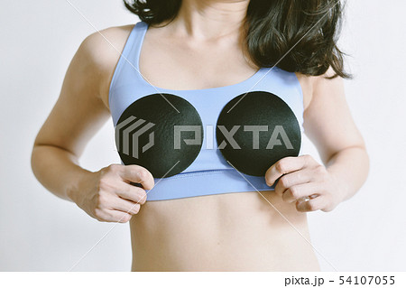 Foto de Upsize your breast, Woman in sportwear showing a bra