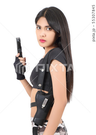 人間 女性 銃 戦闘服の写真素材