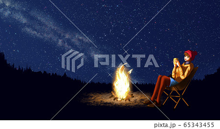 キャンプ 星空 焚き火 天の川の写真素材