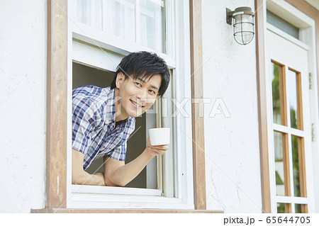 Portrait Of A Young Man Showing His Face Stock Photo