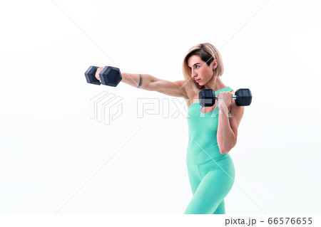 Workout with personal trainer. Instructor helping girl in gym