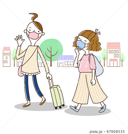 マスクをつけて旅行するふたりの若い女性