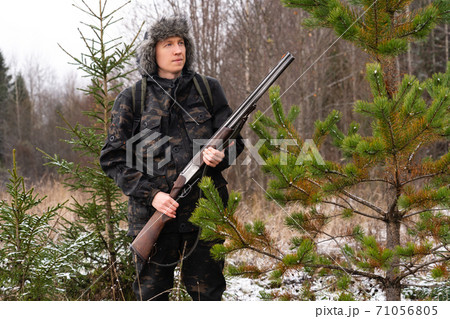 Confident caucasian hunter. American hunting rifles. Hunting