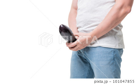 Man in underwear standing isolated on grey background covering his